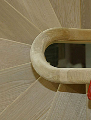 Looking down on a wreathed staircase
