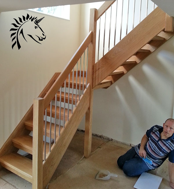 Oak staircase installed at broseley near telford stainless steel balusters